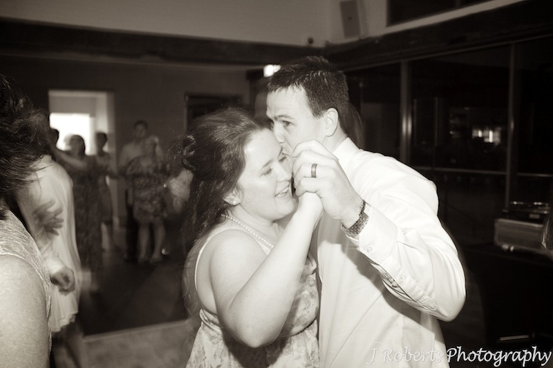 Sepia photo of couple enjoying wedding dancing - wedding photography sydney